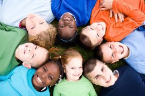 Children smiling together in a circle